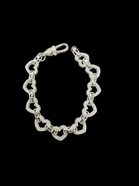 Sterling silver open heart bracelet, large 10mm, small 8mm, showcasing elegant white heart designs.