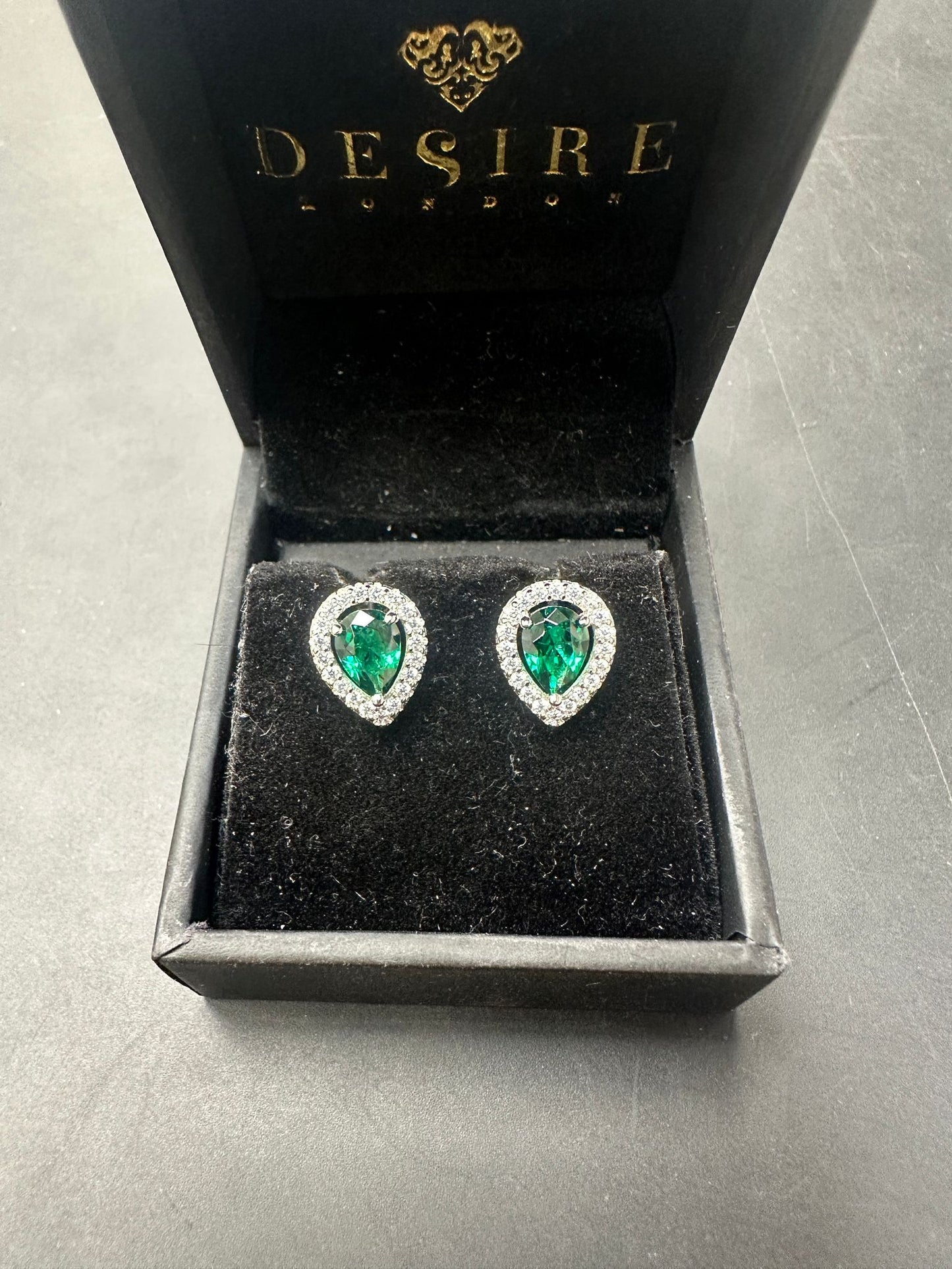 Sterling Silver Stud Earring CZ Stone ECZ6003 in a black box with green stones and sparkling details.