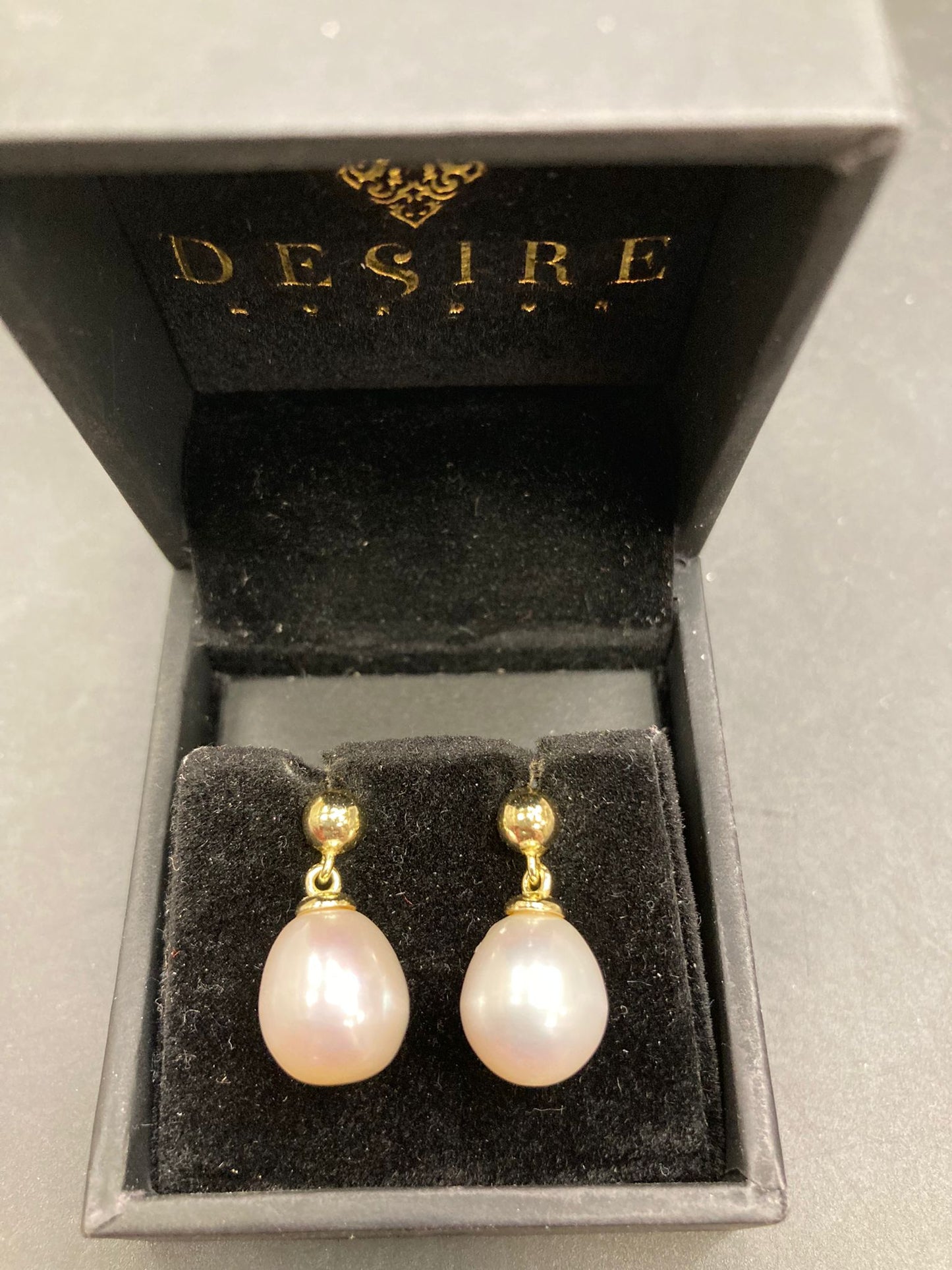 Sterling Silver Teardrop Pearl Earrings ECZ8710 displayed in a black jewelry box, showcasing silver teardrop pearl earrings.