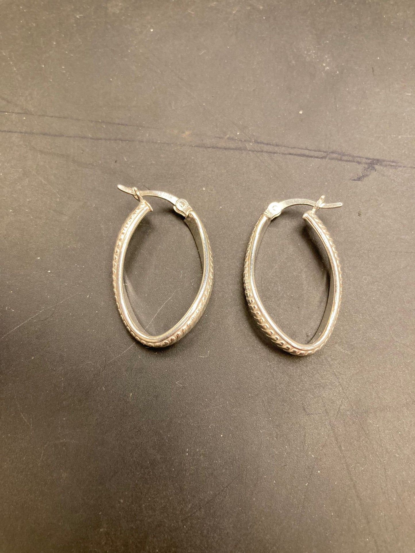 Sterling Silver Textured Oval Hoop Earrings EP10197, featuring beautiful textured sterling silver hoop earrings design.