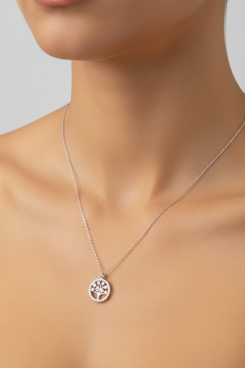 Close-up of a model wearing a sterling silver plain tree of life necklace NCZ015 on her neck.