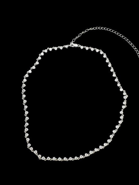 Sterling silver cz stone necklace featuring round 3.0mm stones arranged in a stylish pattern.