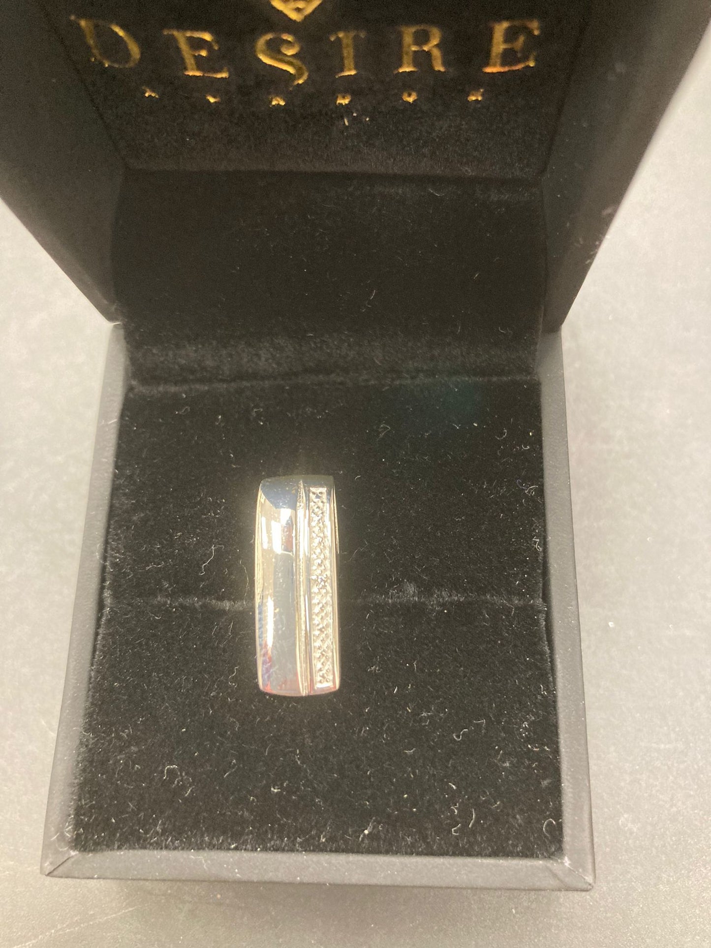 Sterling silver cz pendant PCZ003 displayed in a luxury jewelry box with black velvet lining.