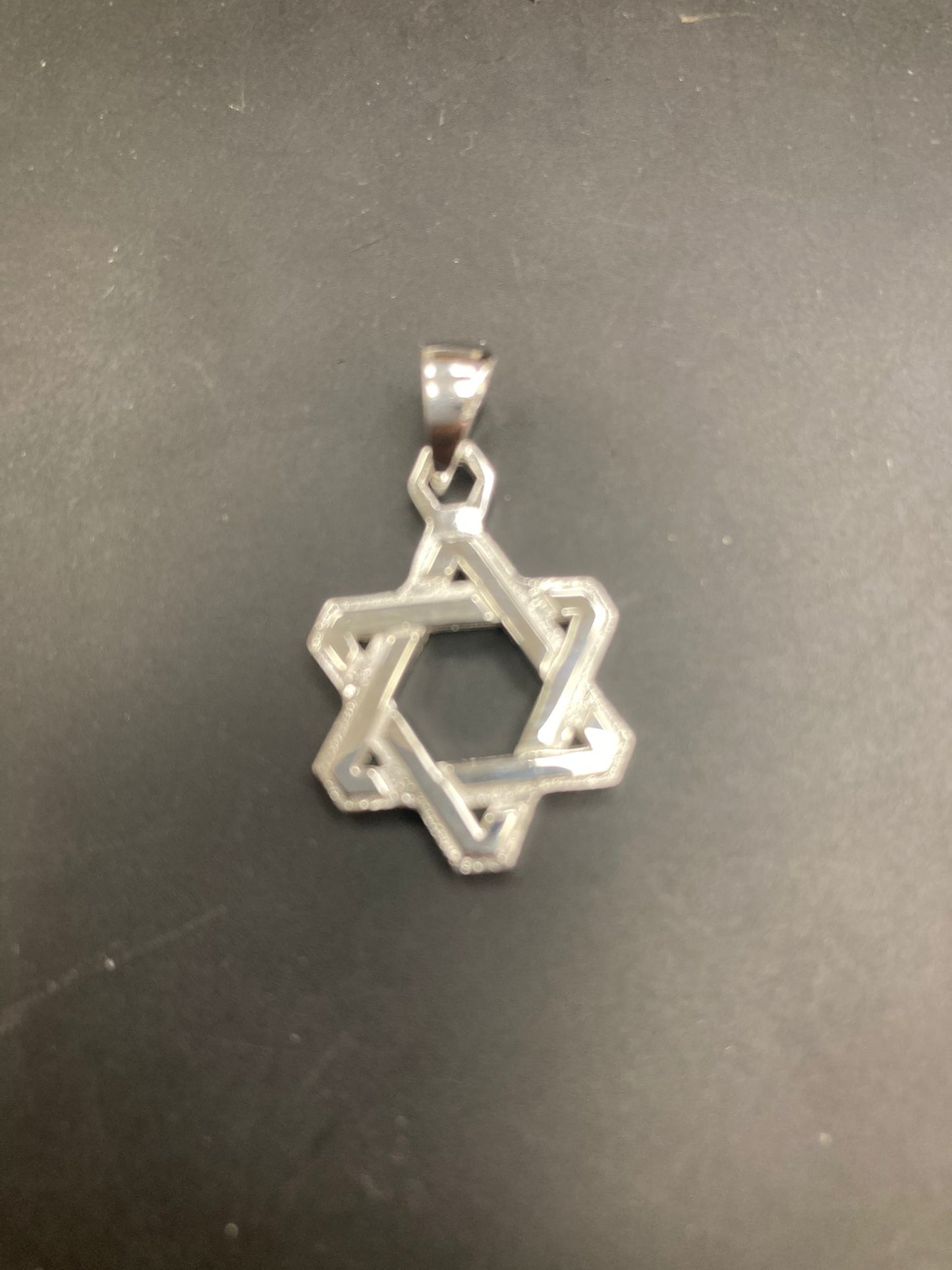 Sterling Silver Star of David Pendant featuring a sleek and elegant design.