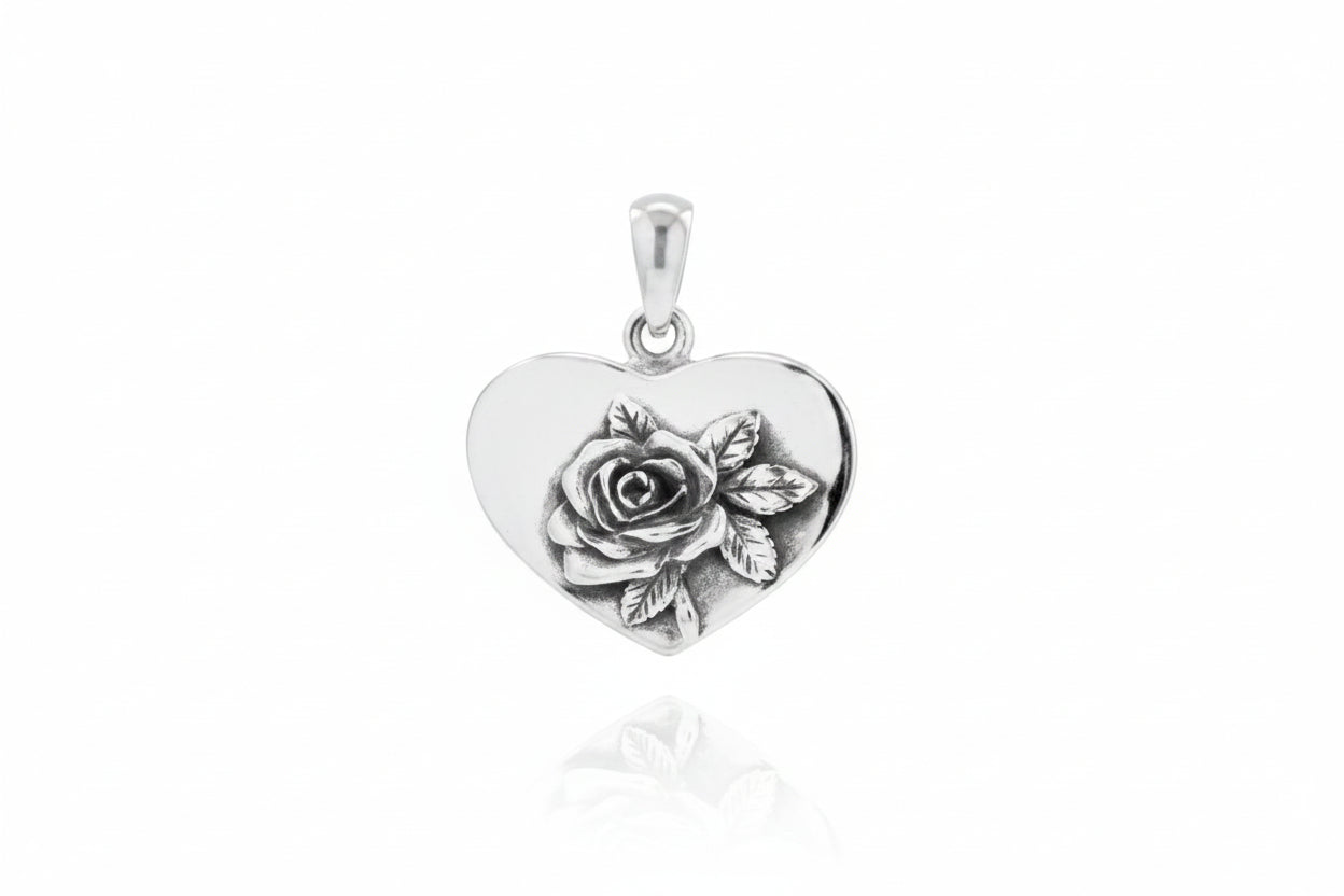 Sterling silver heart pendant featuring a rose design, dimensions 3 x 16 x 18 mm, elegant and romantic jewelry piece.