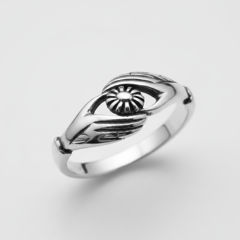 Plain sterling silver ring featuring a unique handmade design with a sun emblem.