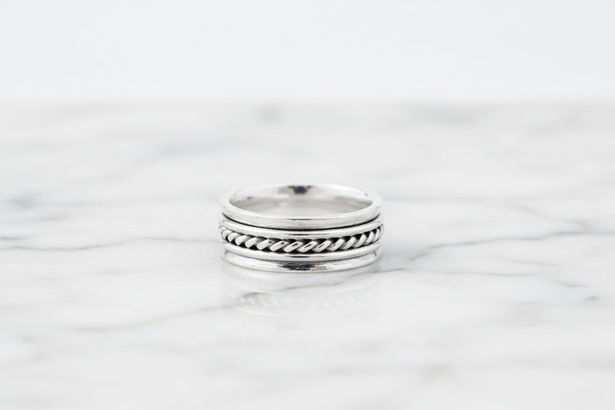 Sterling Silver Spinner Ring TQ230900022 featuring braided design, 6 mm width, perfect for stylish jewelry lovers.