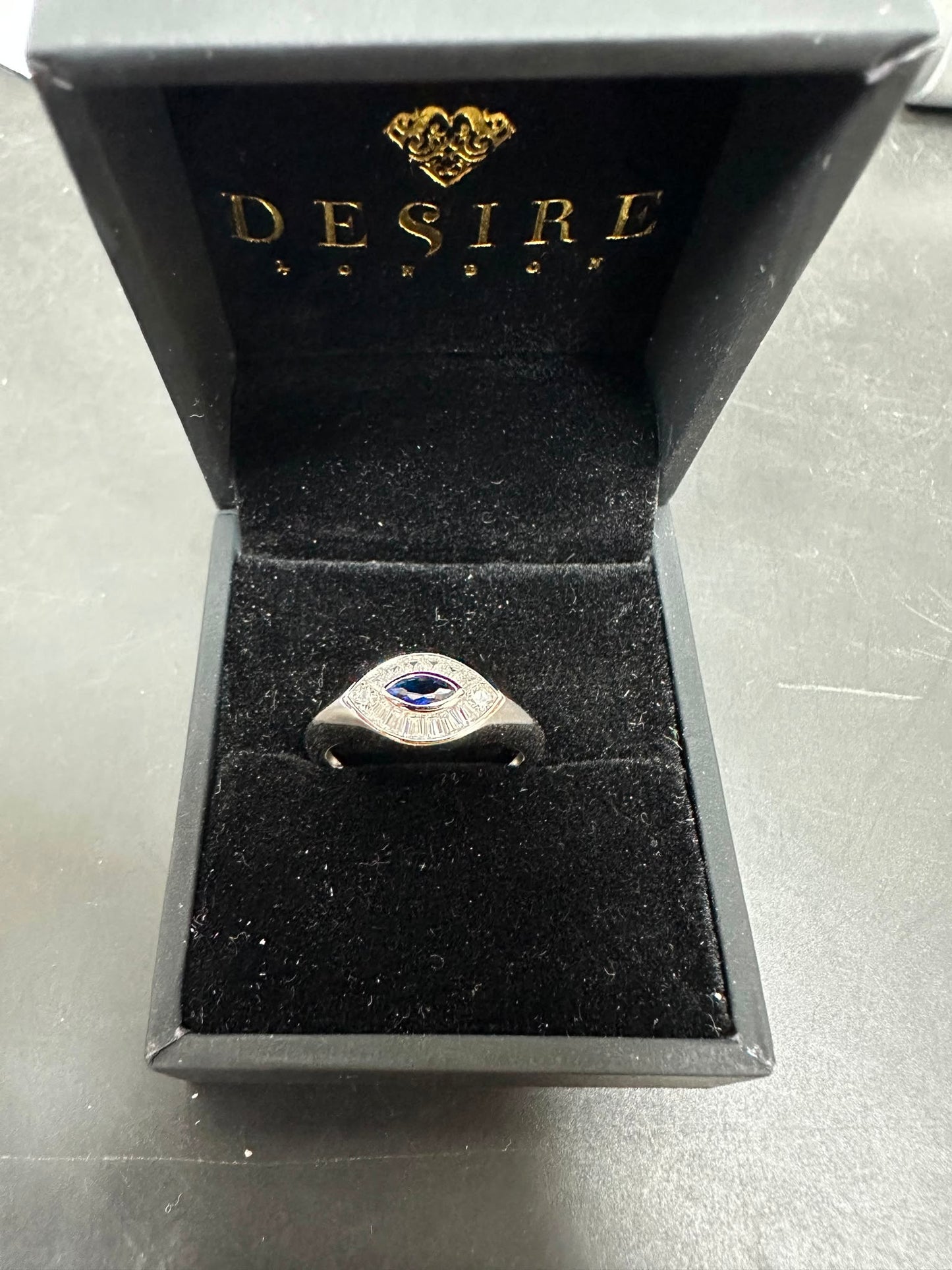 Sterling Silver Evil Eye Ring RCZ2988 displayed in a luxe black jewelry box for a stylish presentation.
