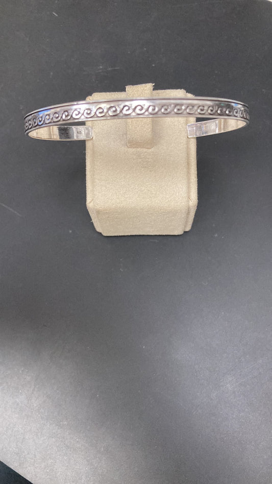 Sterling Silver Plain Wave Design Bangle BA020600030 displayed on a stand, measuring 55x60mm.