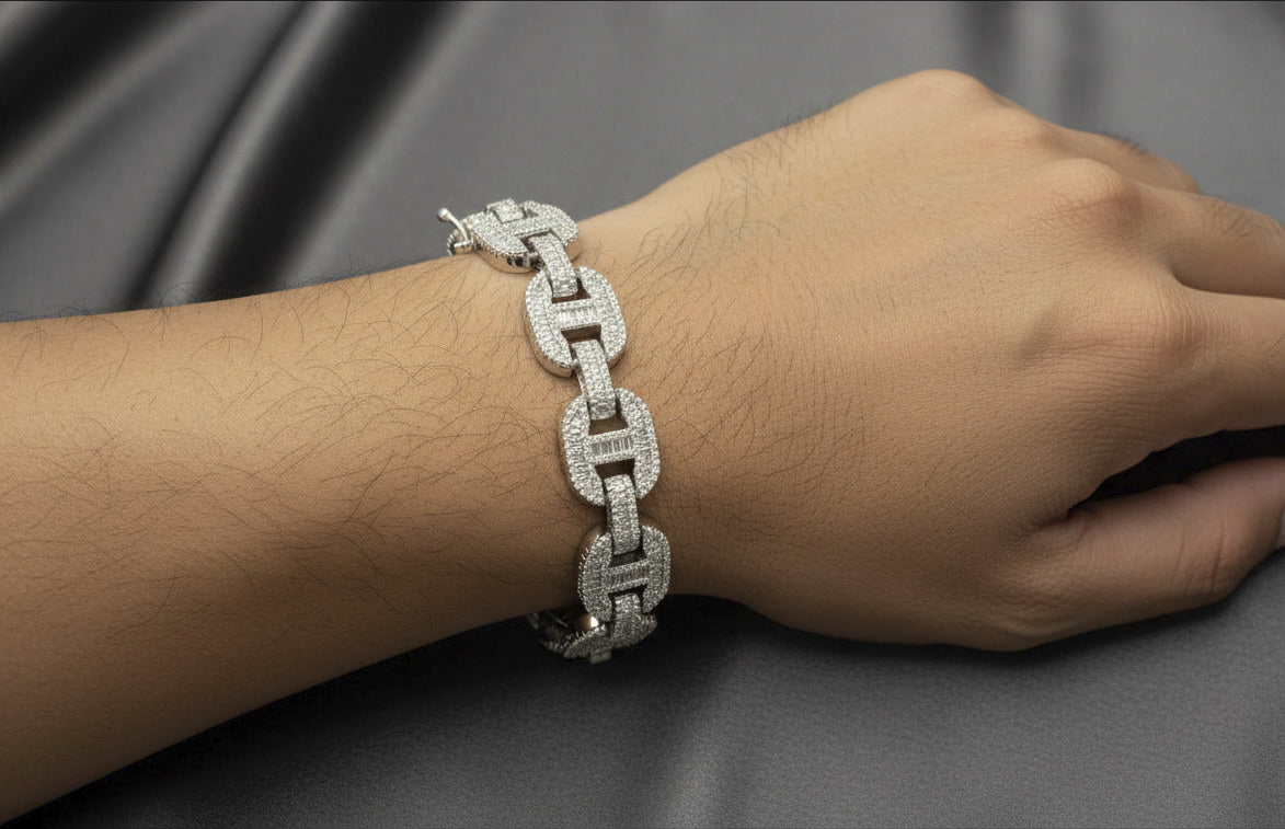 Silver chain bracelet on a dark gray background