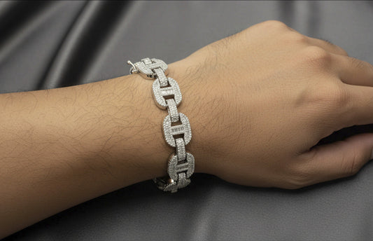 Silver chain bracelet on a dark gray background