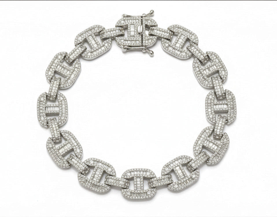 Silver chain bracelet with diamond-like stones on a dark gray background