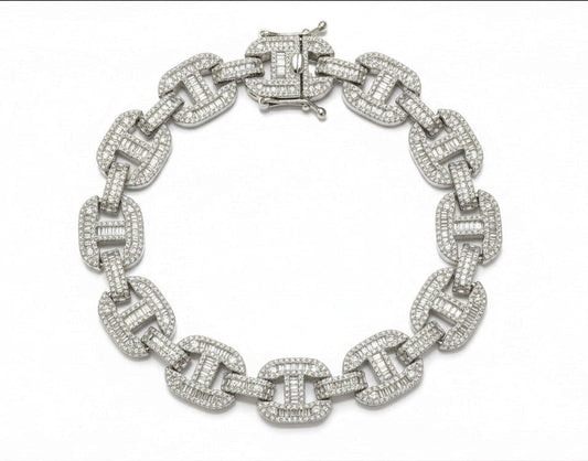 Silver chain bracelet with diamond-like stones on a dark gray background