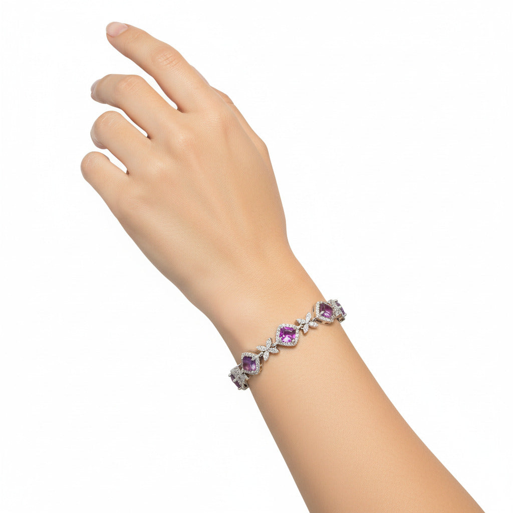 Silver bracelet with PURPLE gemstones on a white background