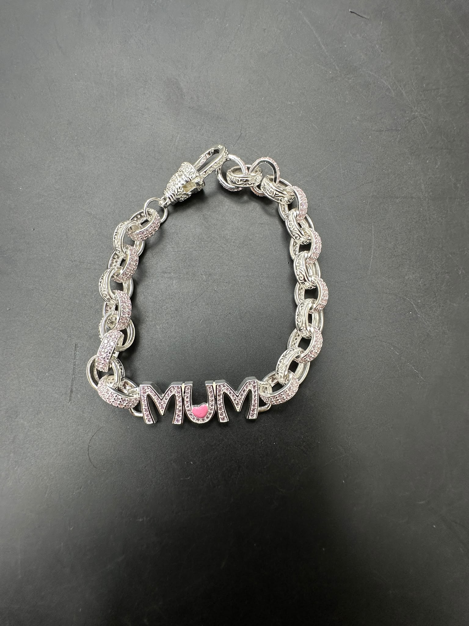 Sterling silver pink cz bracelet featuring MUM design and intricate link pattern, 8.5MM - 8" size.