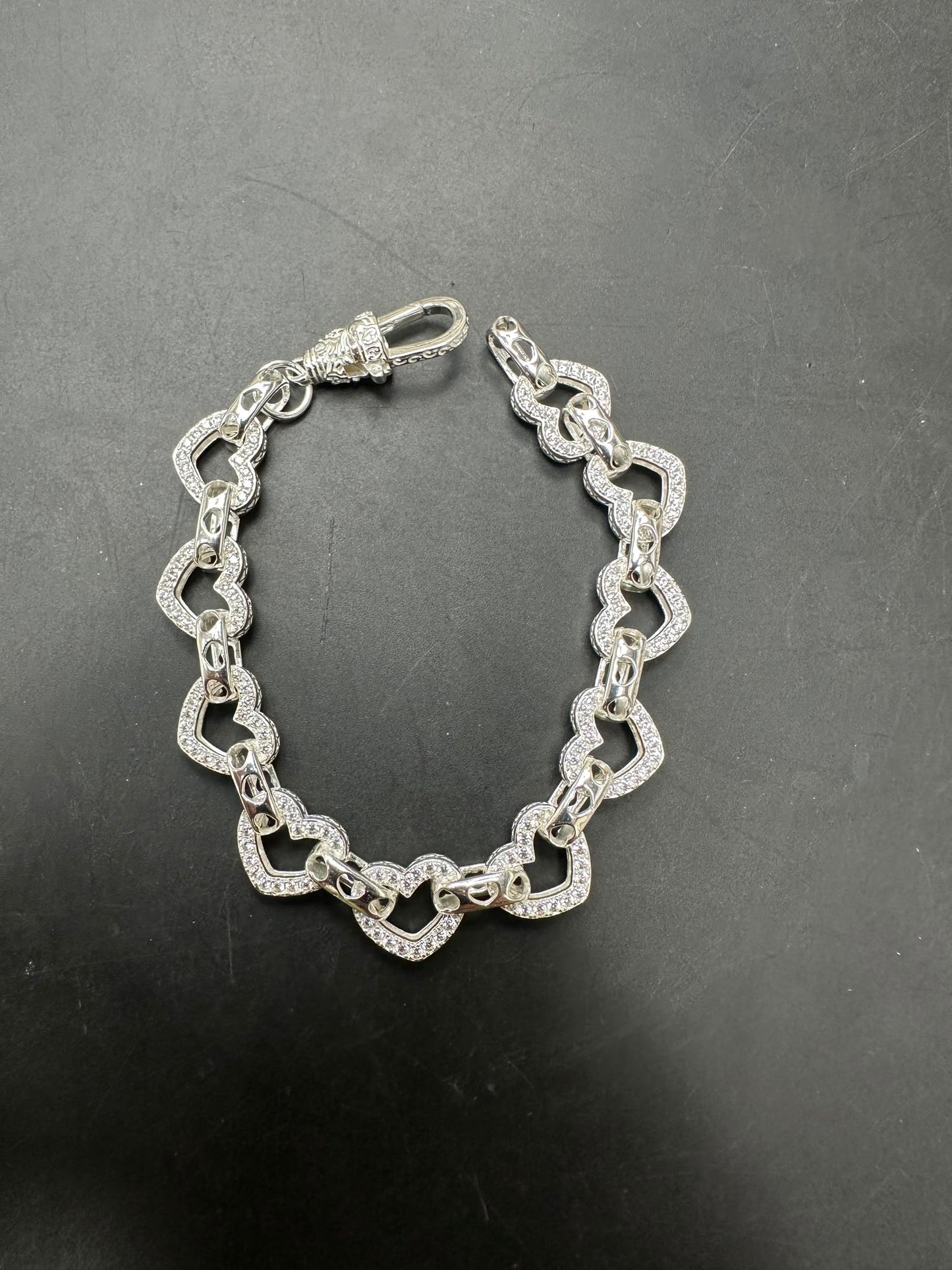 Sterling silver open heart bracelet, large 10mm, small 8mm, showcasing elegant white heart designs.