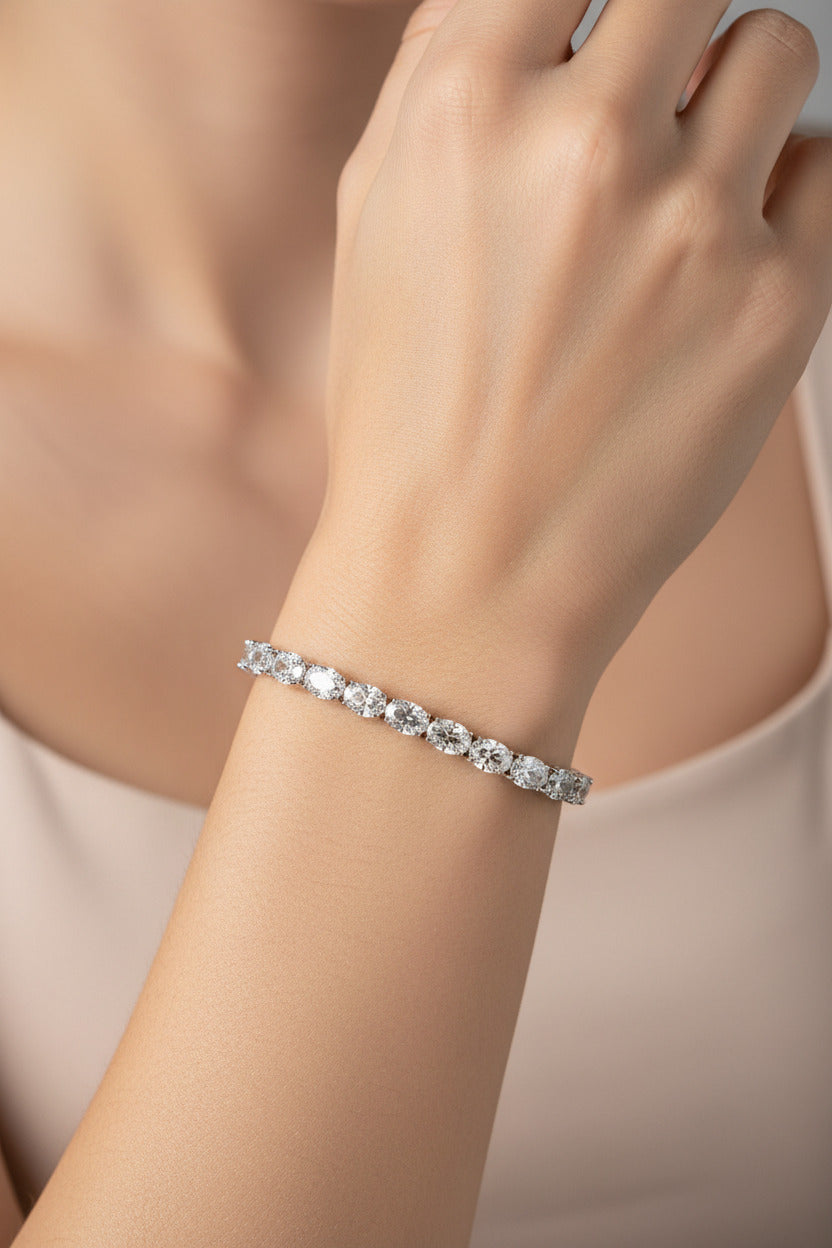 Silver bracelet with clear oval stones on