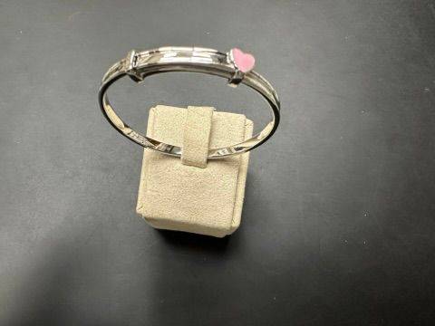 Sterling silver children's heart bangle BGP10119 on display with a pink heart accent.