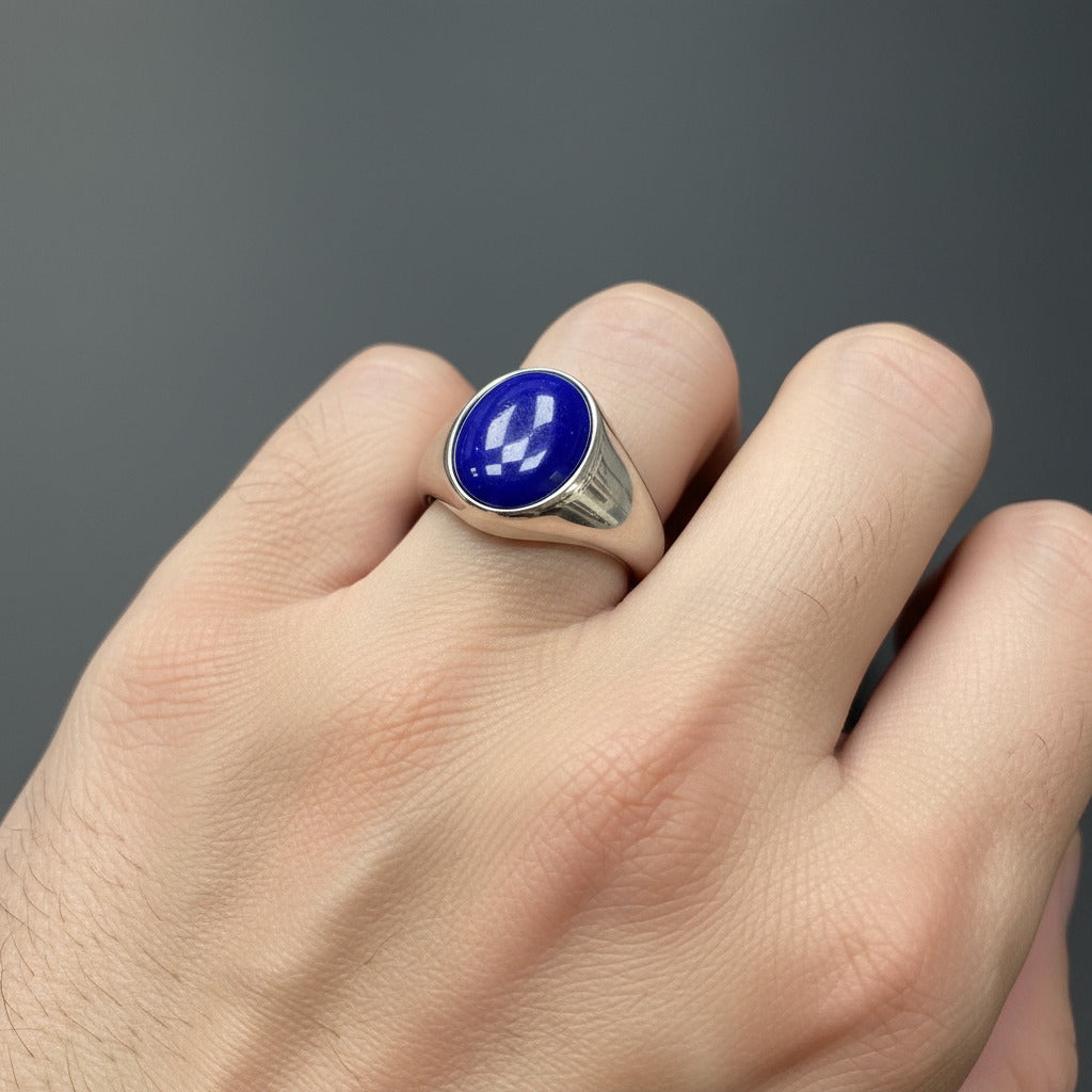 Silver signet ring with a blue stone 