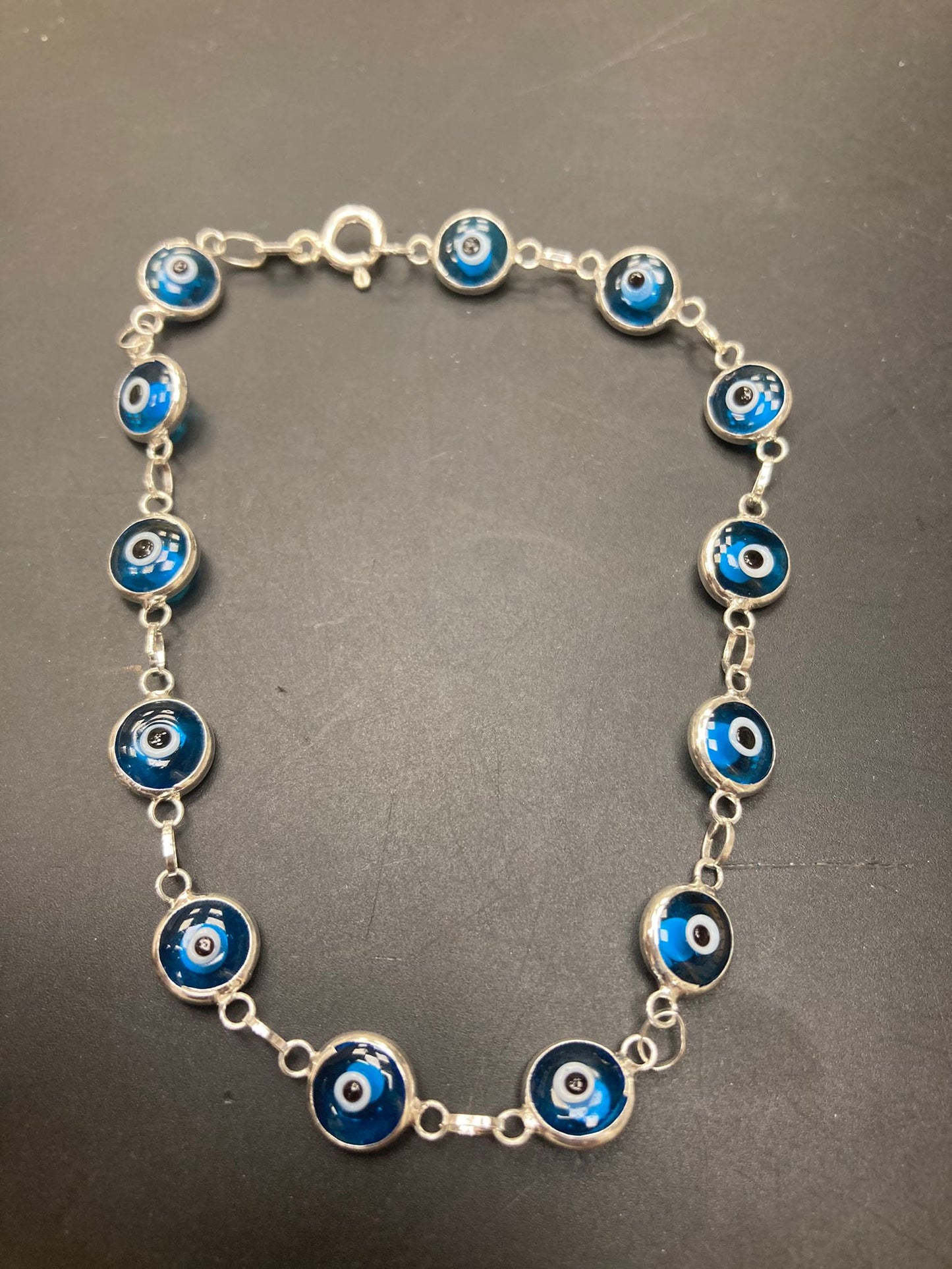 Sterling Silver Evil Eye Bracelet BR001 featuring blue evil eye charms linked with sterling silver chain.