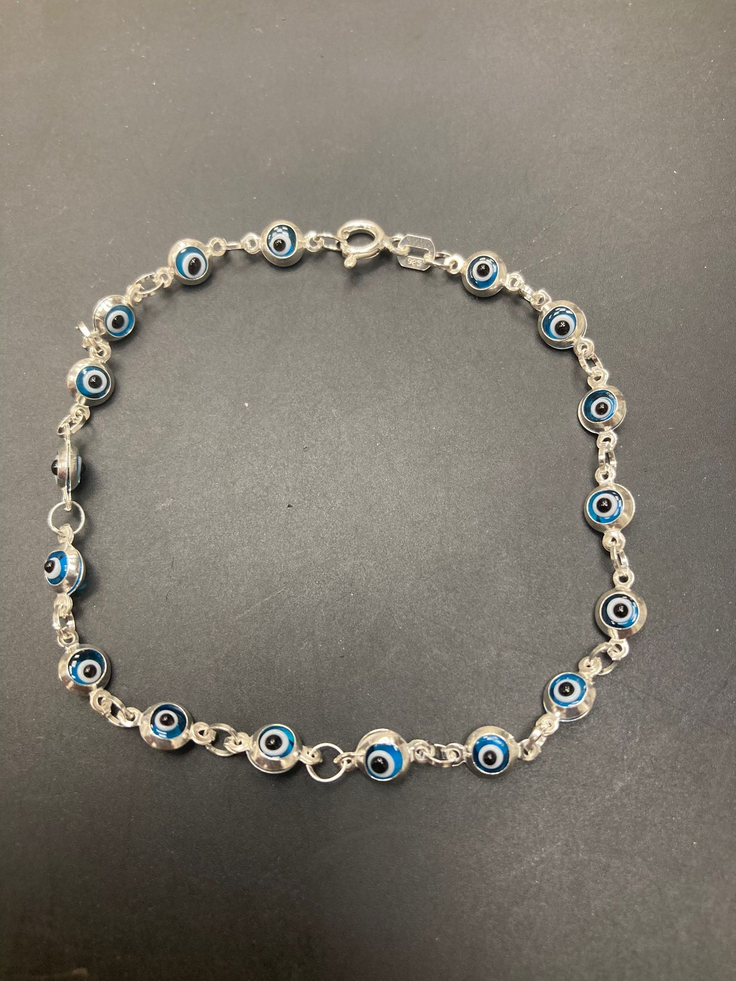 Sterling Silver Evil Eye Bracelet BR001 featuring blue and silver eye designs on a delicate chain.