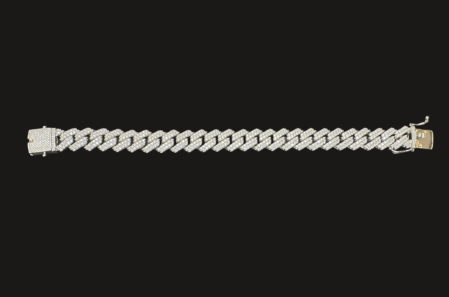 Silver chain bracelet on a dark gray background