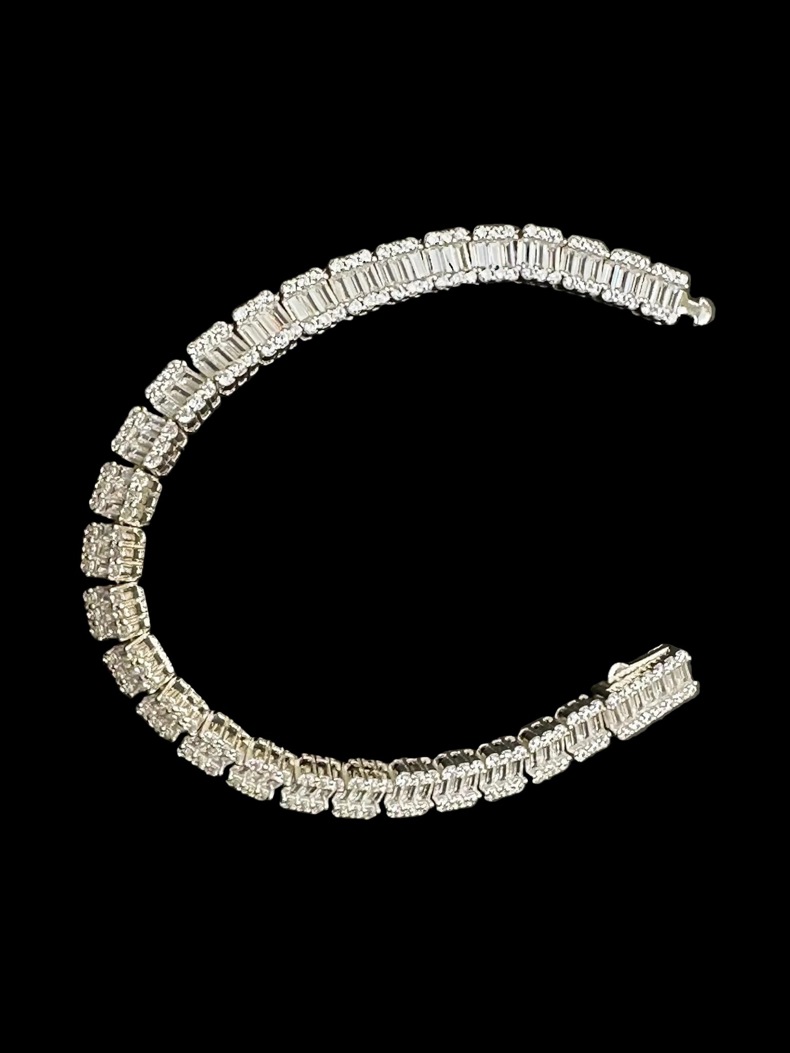 Sterling silver baguette tennis bracelet with sparkling CZ stones, showcasing an elegant design and luxurious appeal.