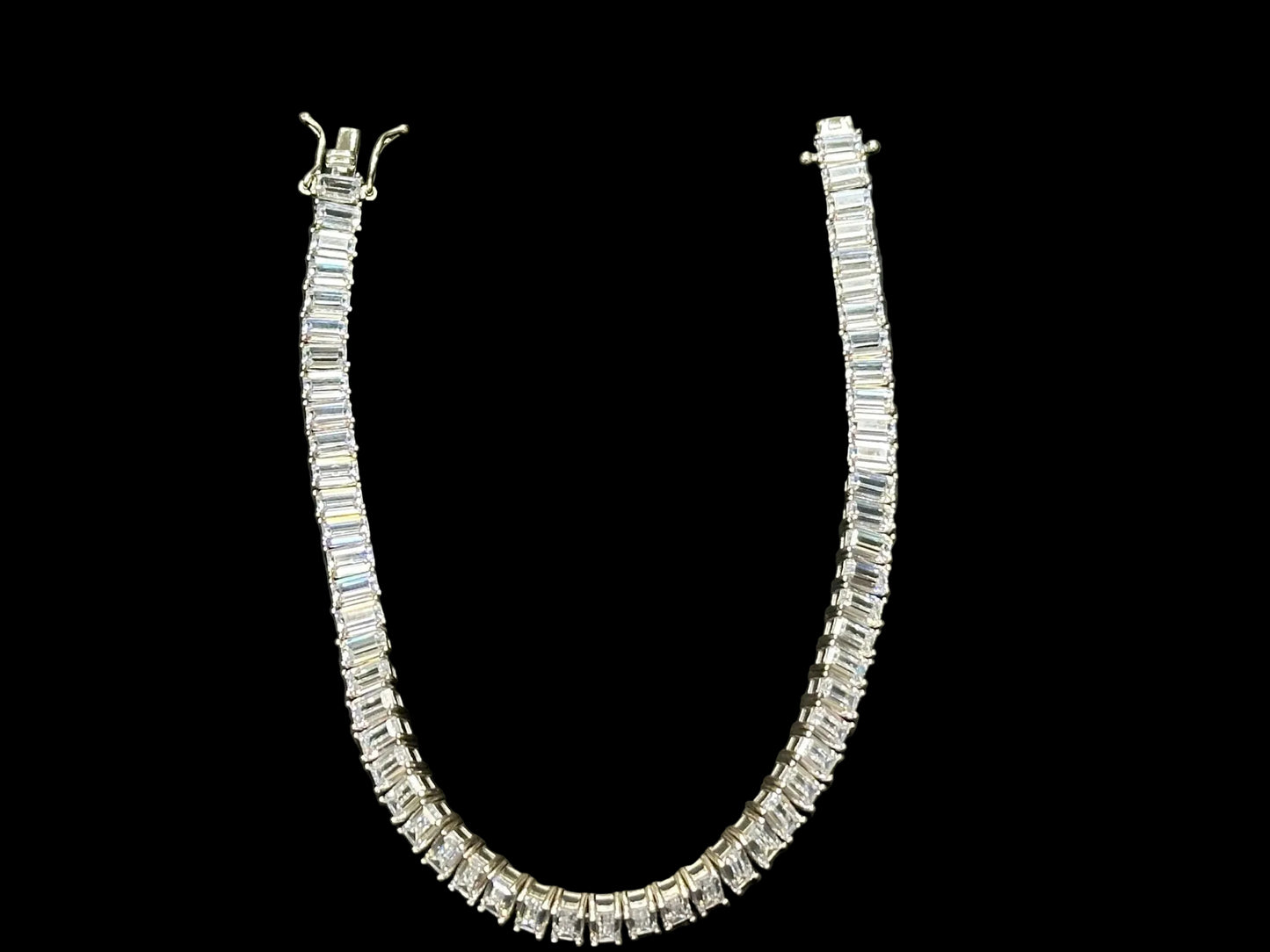 Sterling silver cz emerald tennis bracelet showcasing elegant design with cubic zirconia accents.