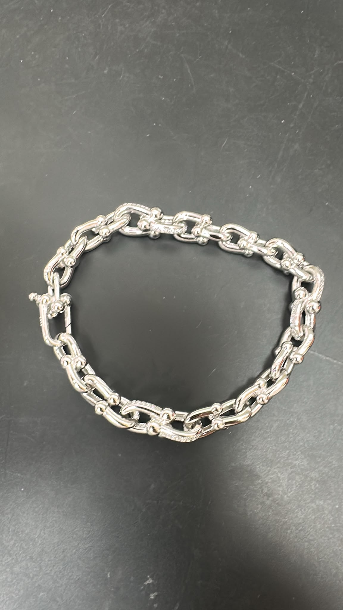 round sterling silver cz bracelet featuring a delicate chain design with polished links.