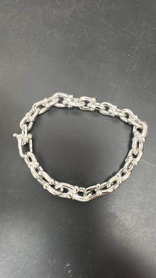round sterling silver cz bracelet featuring a delicate chain design with polished links.