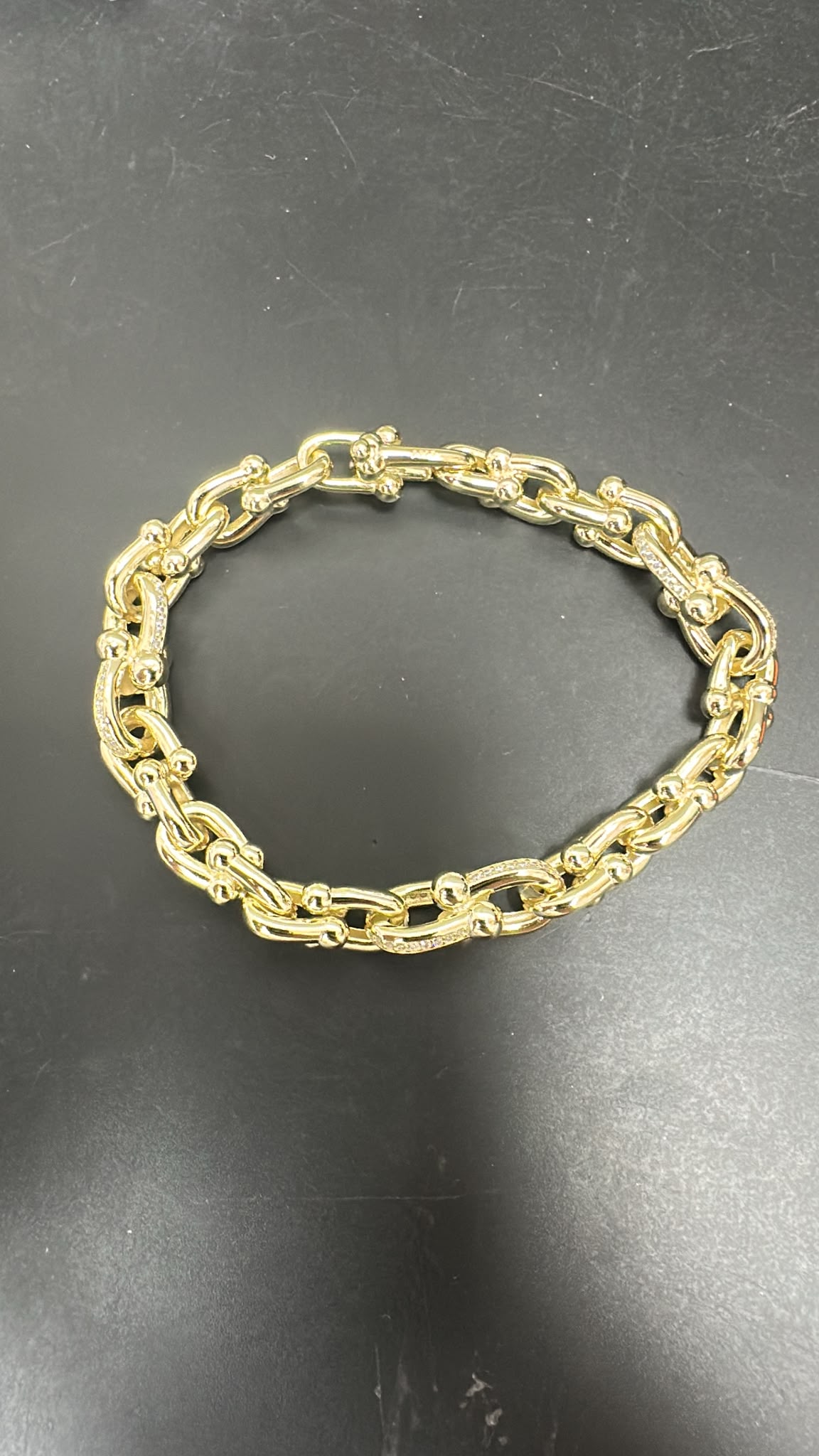 round sterling silver cz bracelet in gold plated finish, featuring unique round shape design.