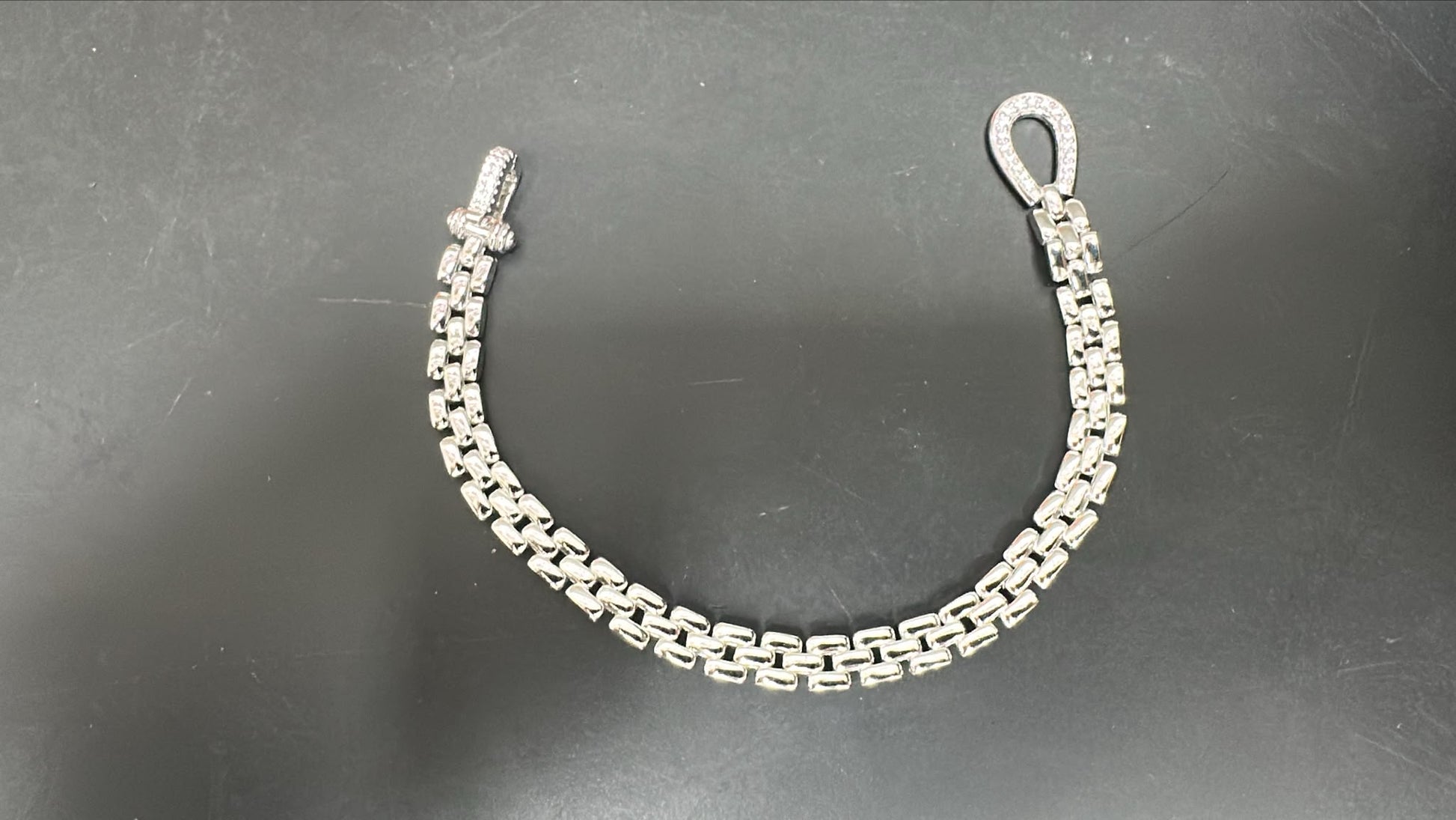 Sterling silver cz bracelet featuring a sleek chain design with sparkling CZ stones.