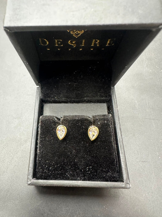 Sterling silver pear cut stud earrings with gold plated finish in elegant Desire box.