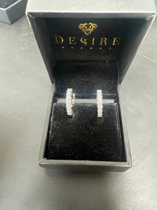 Sterling Silver Cz Huggies ECZ0263 in a black jewelry box, featuring sparkling CZ stones.