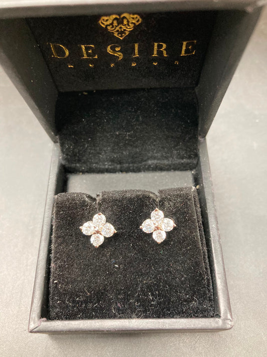 Sterling silver cz studs displayed in a Desire jewelry box with round 3.0mm stones, showcasing elegance.
