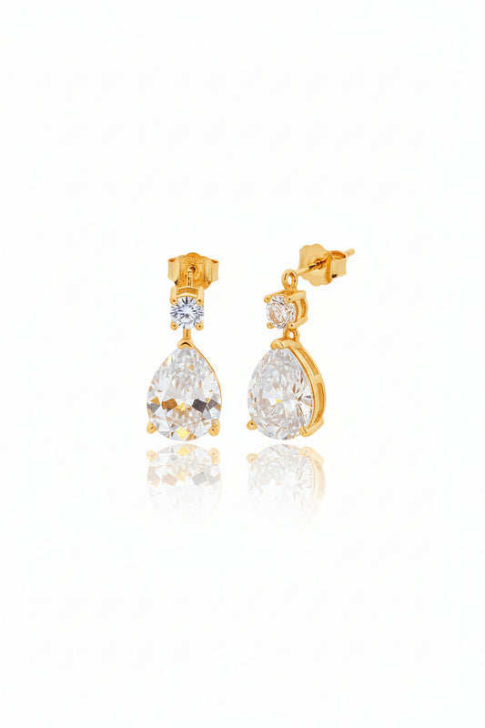 Sterling silver pear drop earrings with gold plated finish and CZ stones, featuring pear and round shapes.