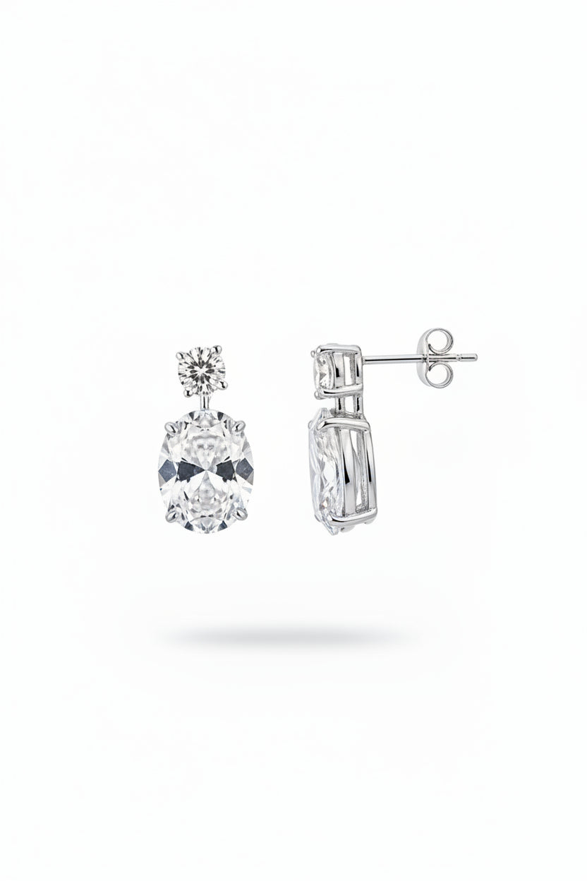 Sterling silver oval drop earrings with cz stone featuring round and oval cut stones, perfect for elegant occasions.