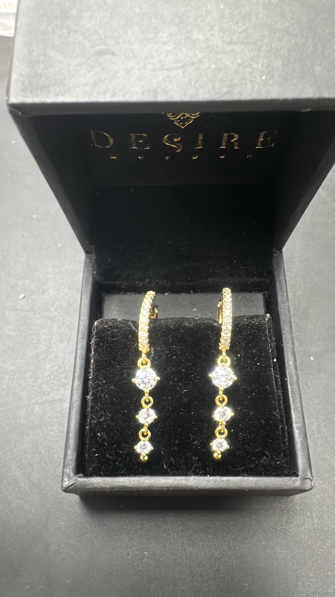 Sterling silver drop earrings cz stone displayed in a jewelry box featuring dazzling cz stones.