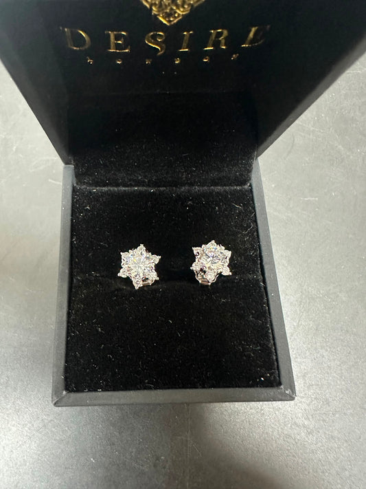 Sterling silver cz stud earrings in a black velvet display box showcasing 5.0mm centre and 1.75mm sides.