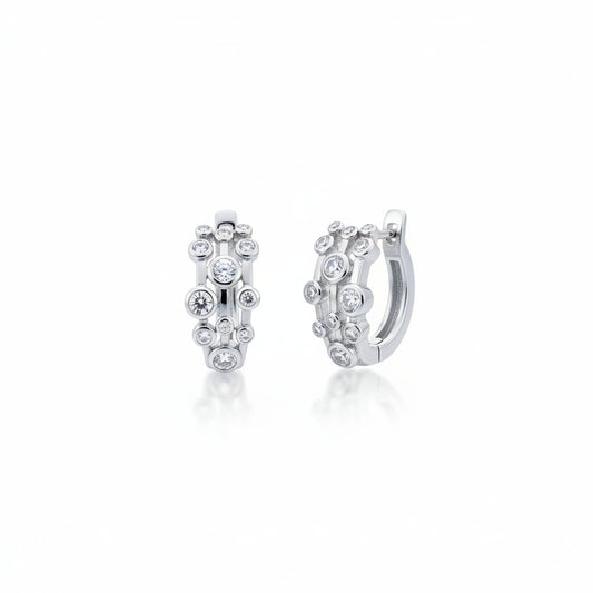 Sterling silver huggie earrings featuring bubbles design and sparkling cz stones, perfect for chic elegance.