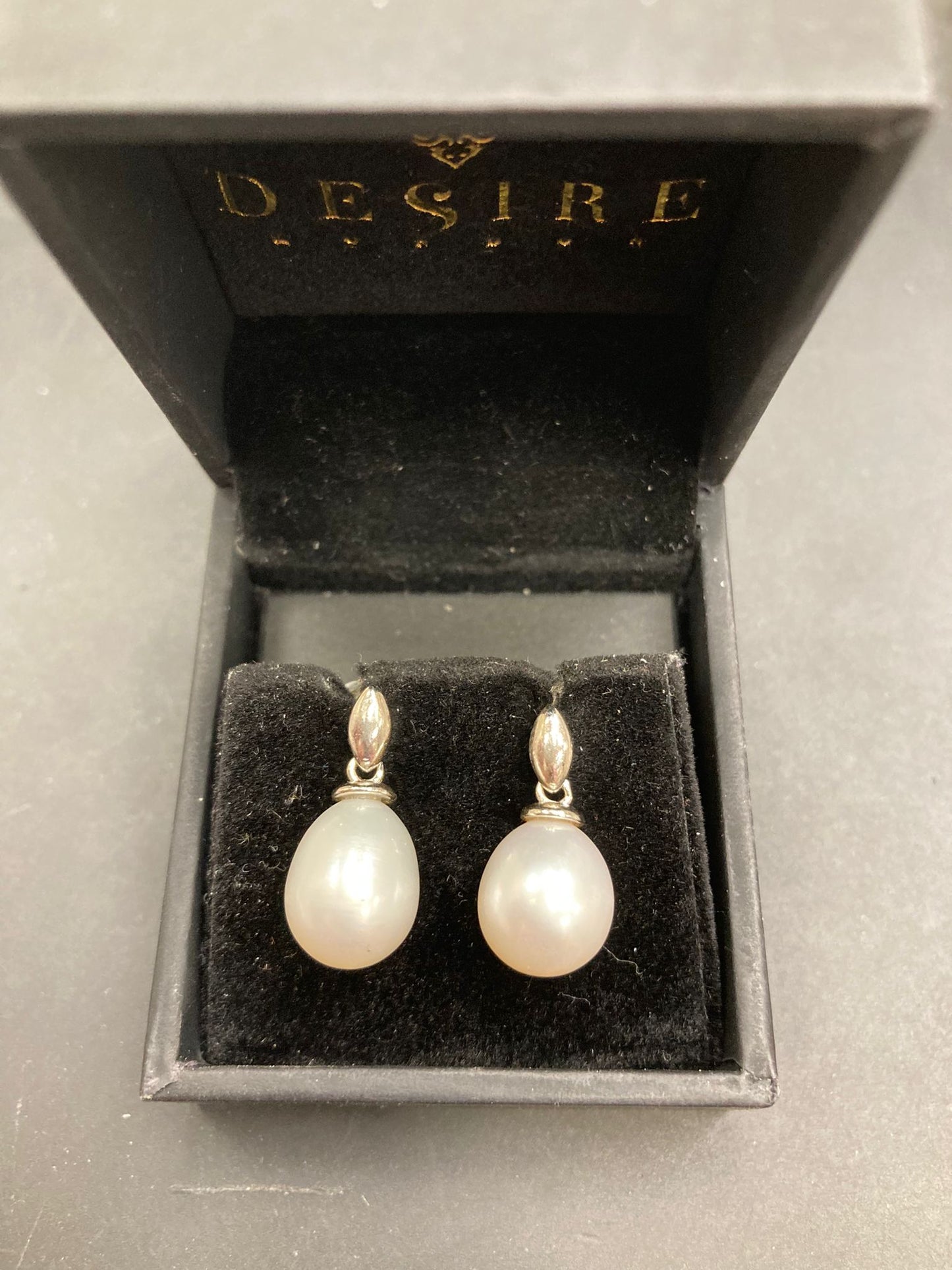 Sterling Silver Tear Drop Pearl Earrings ECZ6004 displayed in a black jewelry box, highlighting their elegant design.