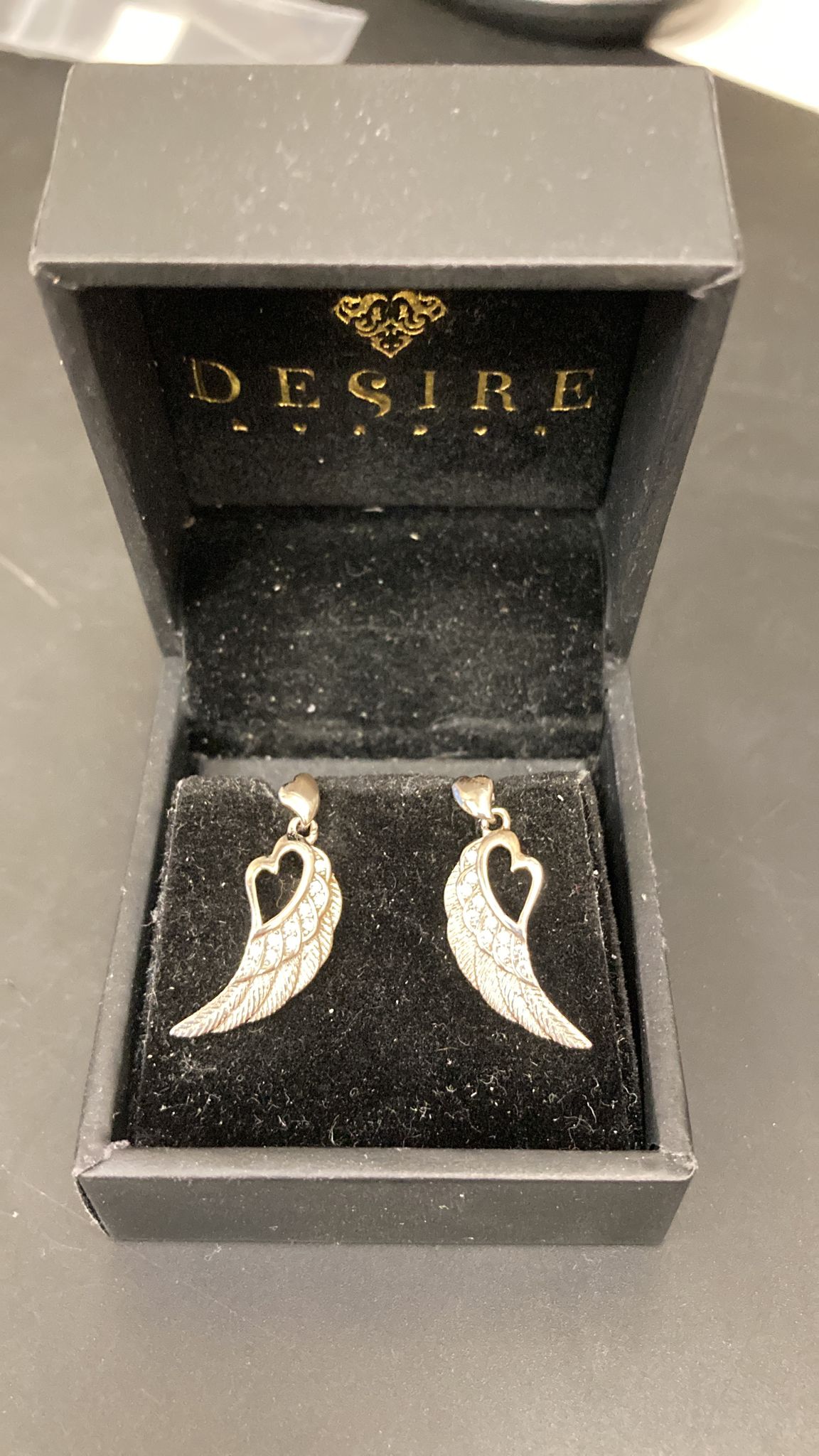 Sterling Silver Cz Open Heart Wings Earrings ECZ8312 in Desire box, showcasing sterling silver open heart wings earrings.