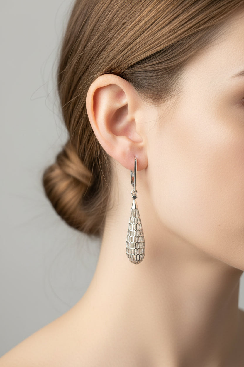 Sterling silver mesh drop earrings showcased on a model, highlighting their elegant design and style.