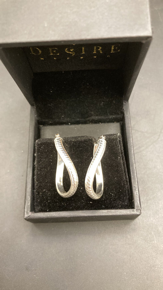 Sterling Silver Twisted Earring EP0007 displayed in a black jewelry box with a luxurious feel.