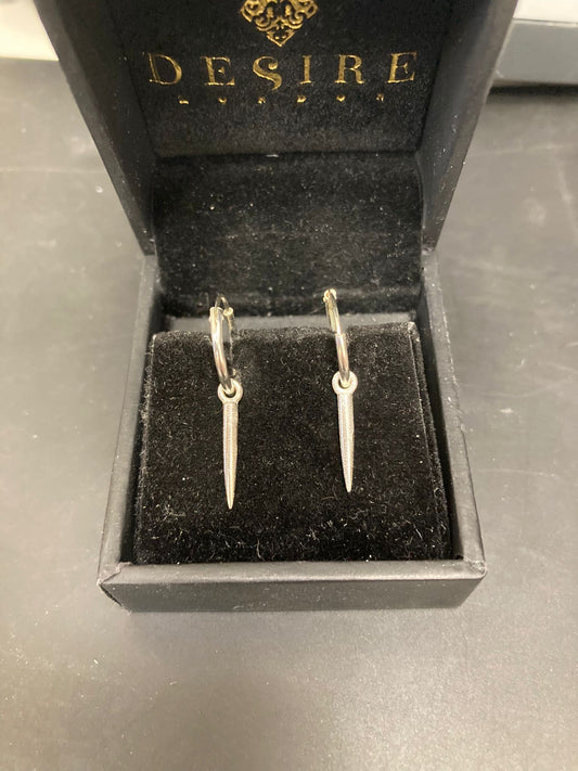Sterling silver hoop earrings featuring stylish spike design in black velvet box.