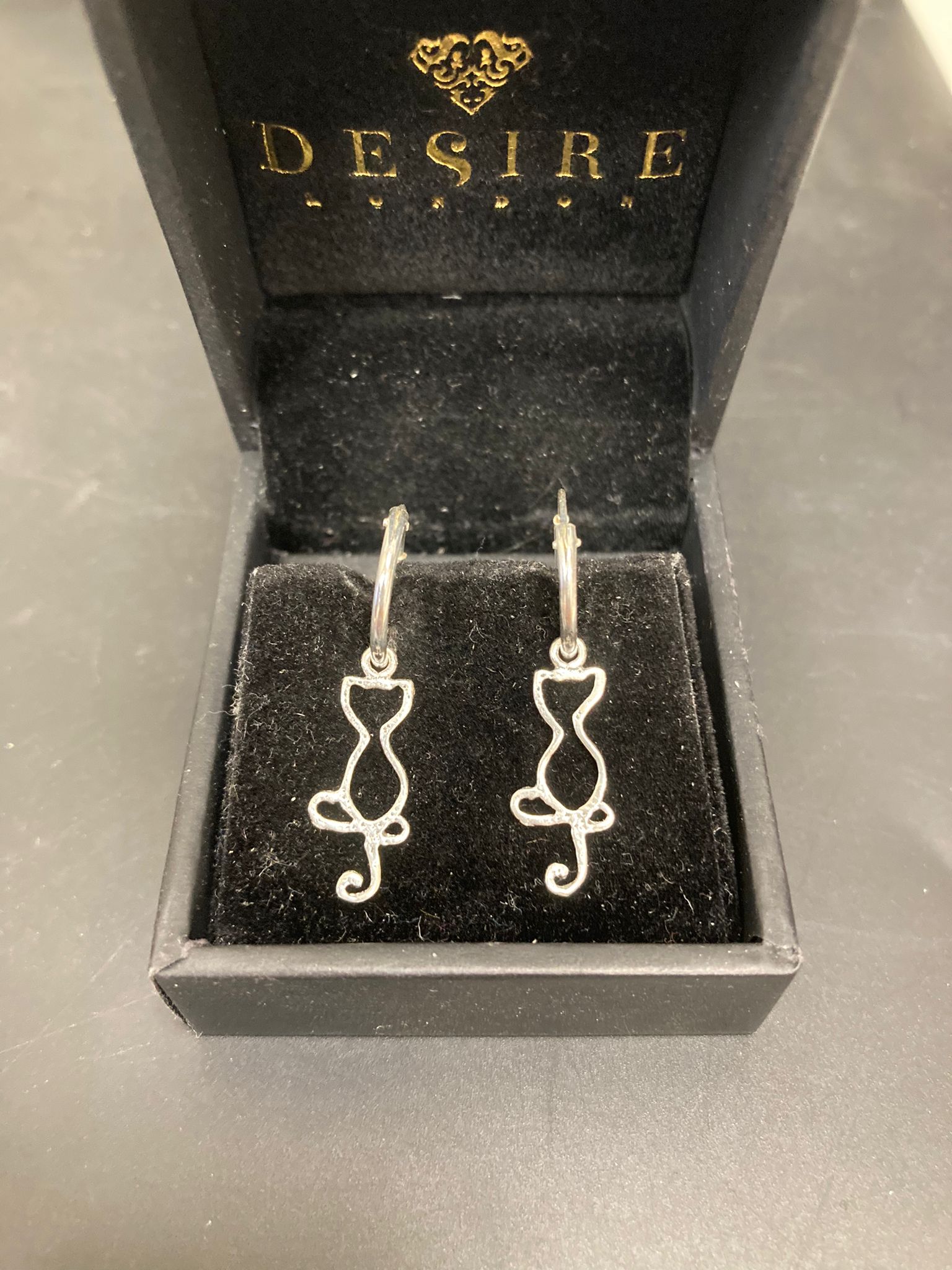 Sterling Silver Cat Drop Earrings EP0013 displayed in a jewelry box, showcasing sterling silver cat earrings design.