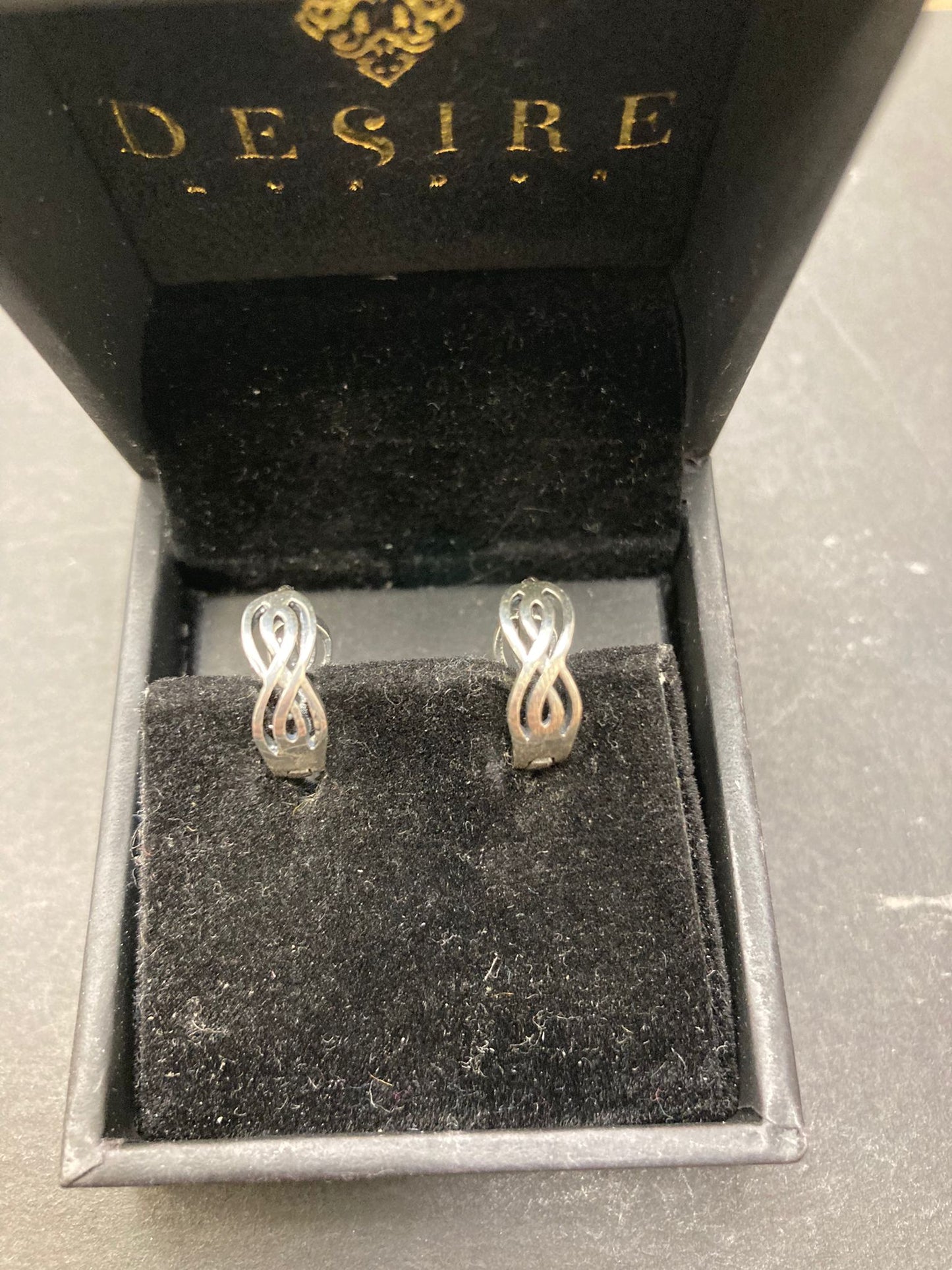 Sterling Silver Hyperbola Infinity Earrings EP010010153 in jewelry box, showcasing sterling silver infinity earrings.