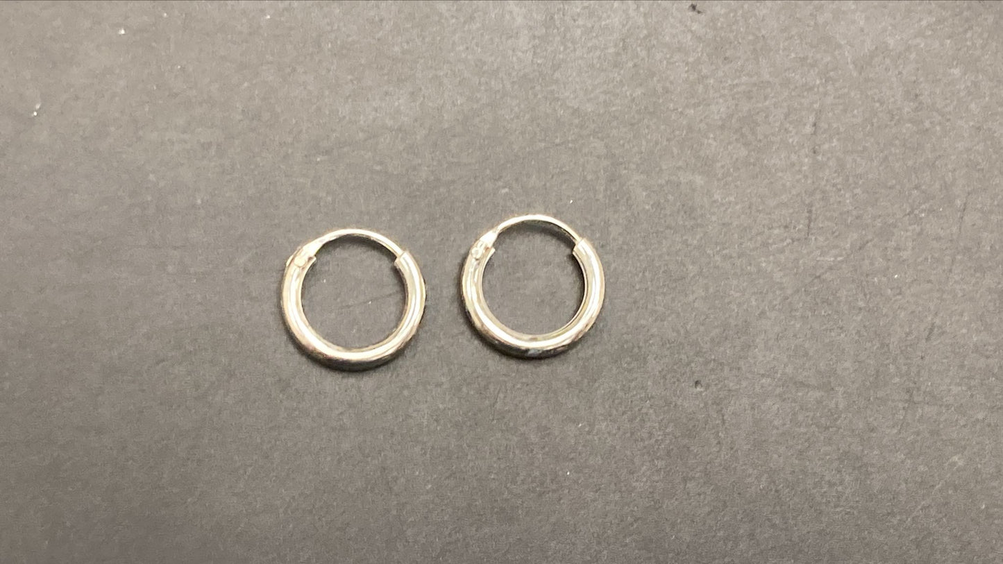 Sterling Silver Round Hoop Earring EP010340233, stylish sterling silver round hoop earrings on a black background.