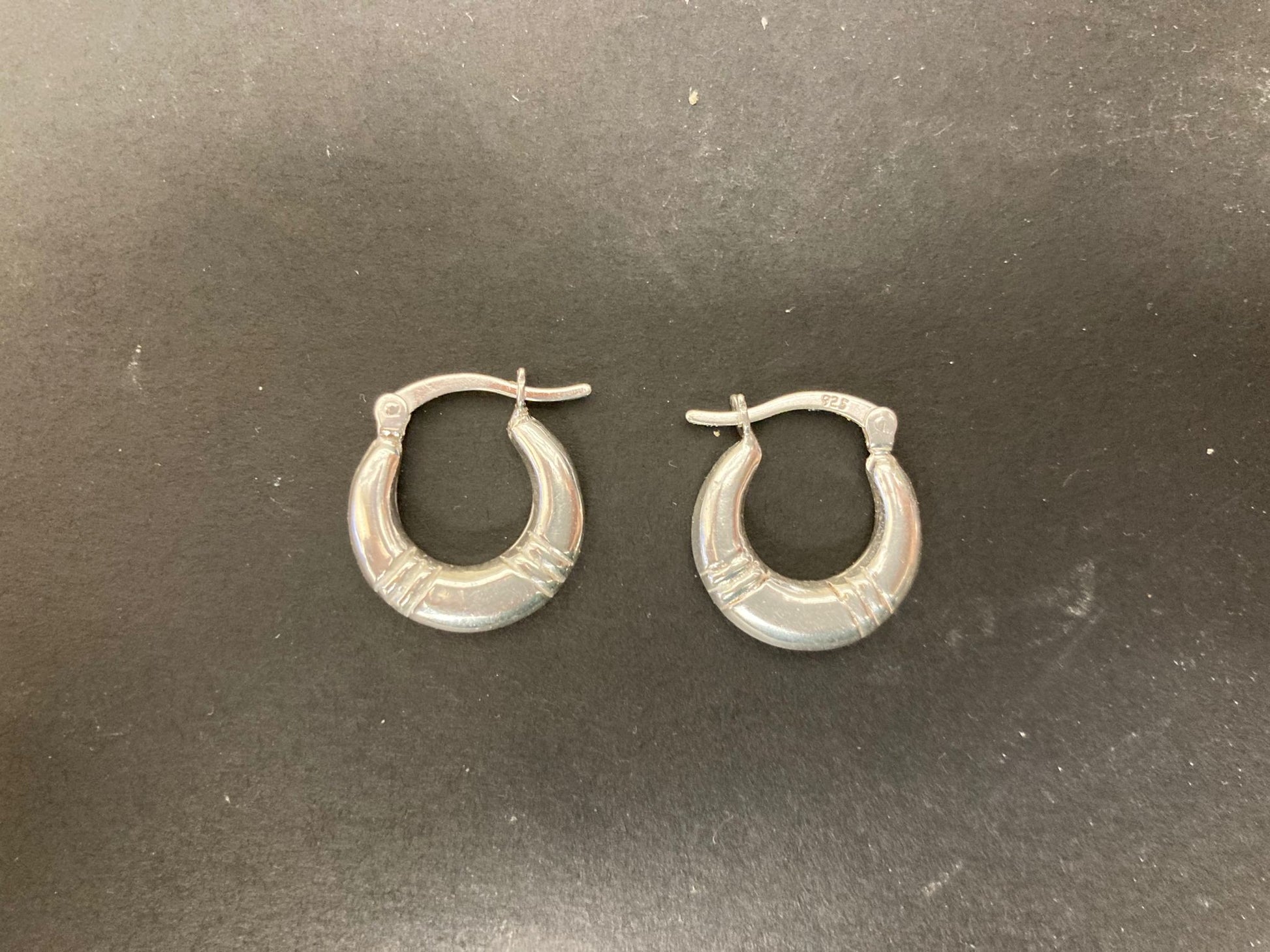 Sterling Silver Creole Hoop Earrings featuring a unique design, perfect sterling silver hoop earrings accessory.