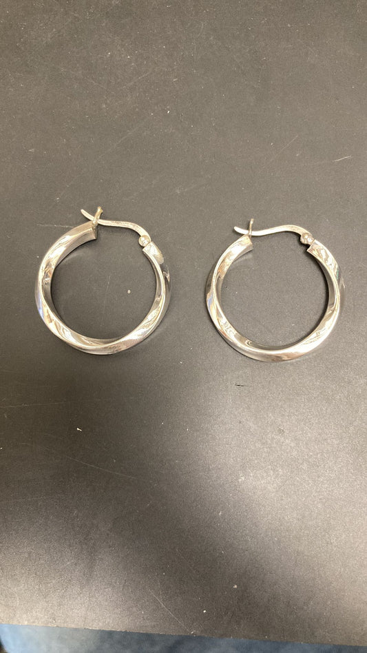 Sterling Silver Twisted Hopp Earrings EP011710068 - twisted silver hop earrings displayed on a black surface.